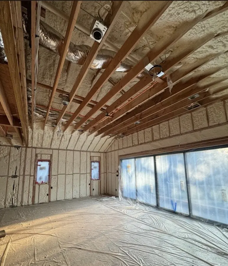 Interior walls and ceiling insulated with spray foam during new construction in Loughman
